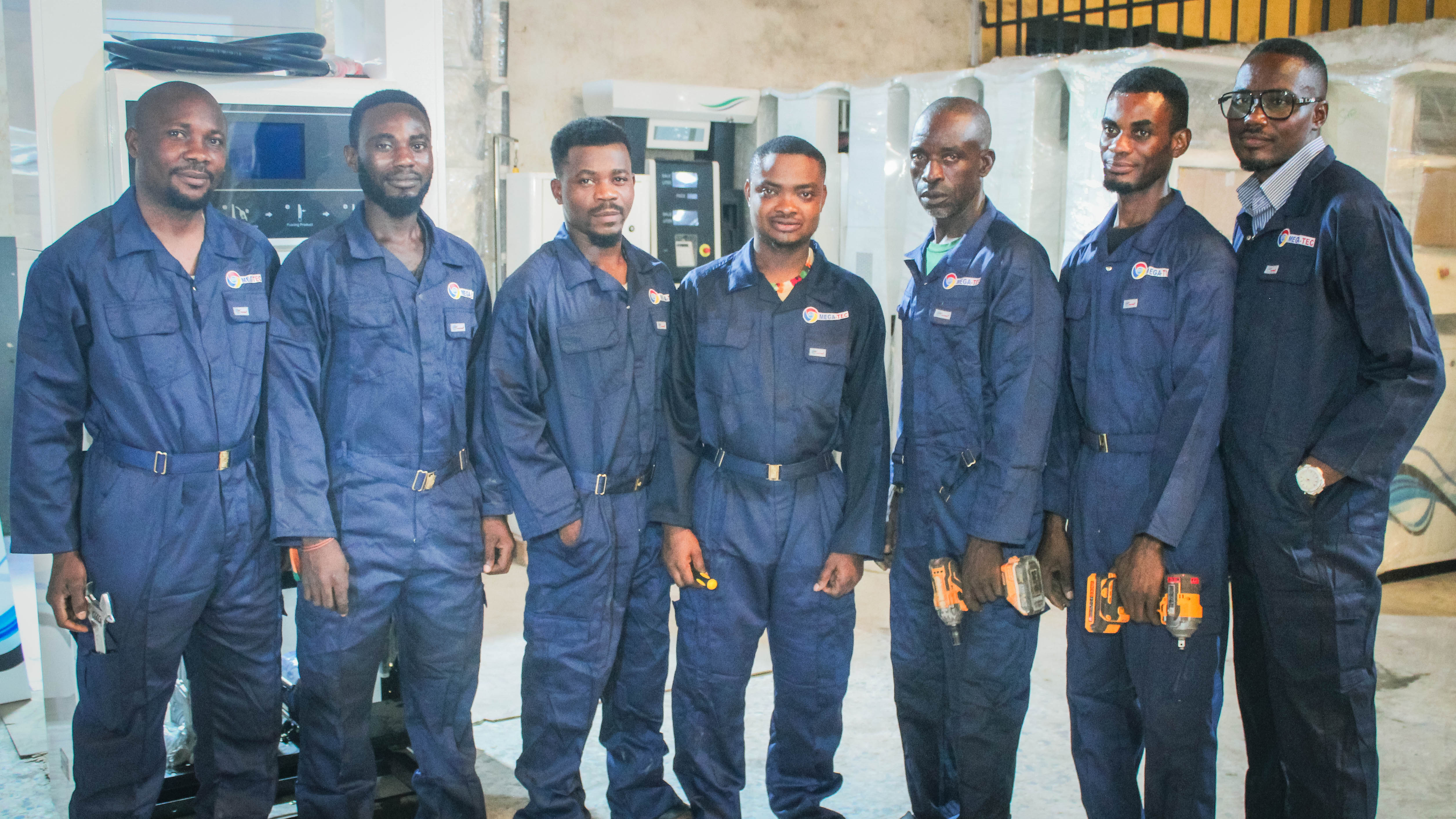 MEGA-TEC engineers in company overalls
